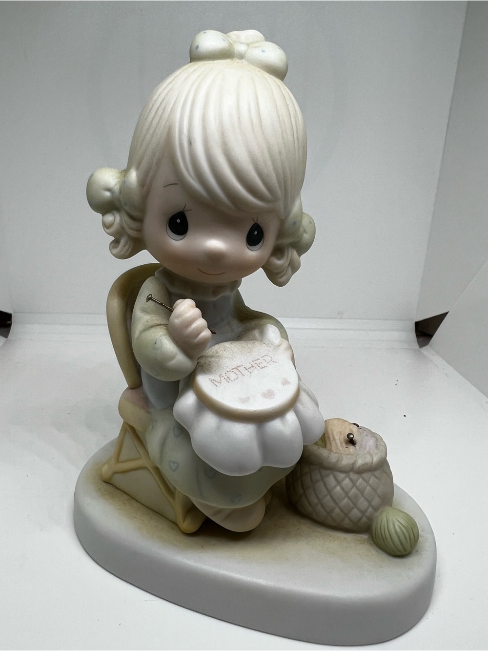 Precious Moments girl Sewing 'MOTHER' Embroidery in Cream and Pastel Green 1979